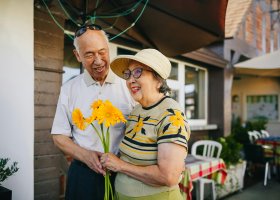 a senior couple with a fresh bouquet